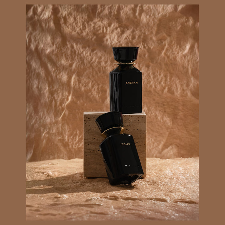 Oman Luxury Angham Eau de Parfum bottle on a sandstone plinth