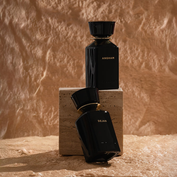 Oman Luxury Angham Eau de Parfum bottle on a sandstone plinth