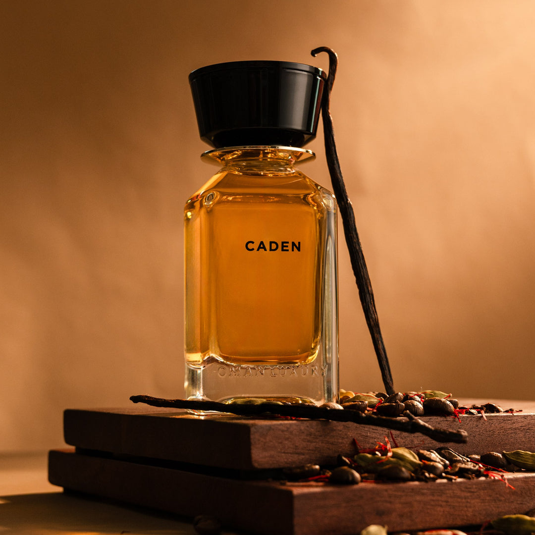 Oman Luxury Caden Eau de Parfum bottle on dark wood with coffee beans