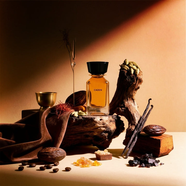 Oman Luxury Caden Eau de Parfum bottle in a still life of spices and vessels