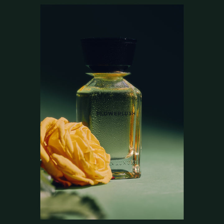 Oman Luxury Flowerlush Eau de Parfum bottle with a yellow rose on green