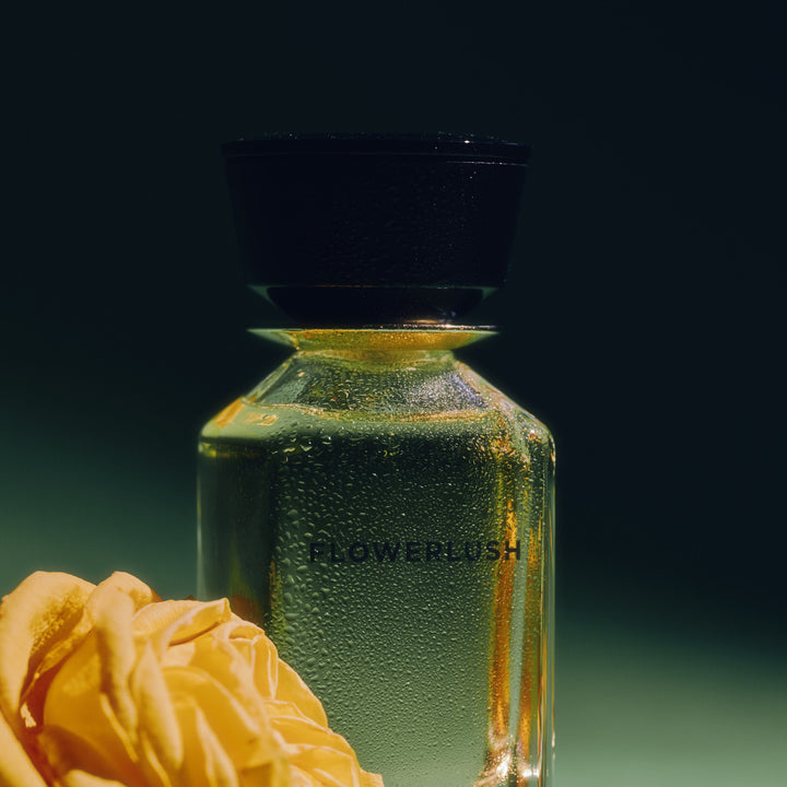 Oman Luxury Flowerlush Eau de Parfum bottle with a yellow rose on green