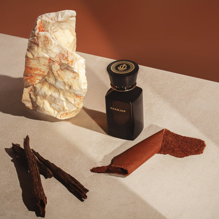 Oman Luxury Khanjar Eau de Parfum bottle with agarwood sticks, ground spice and pale stone