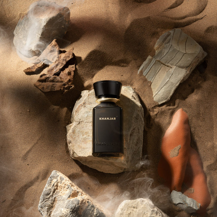 Oman Luxury Khanjar Eau de Parfum bottle on desert rock and sandstone