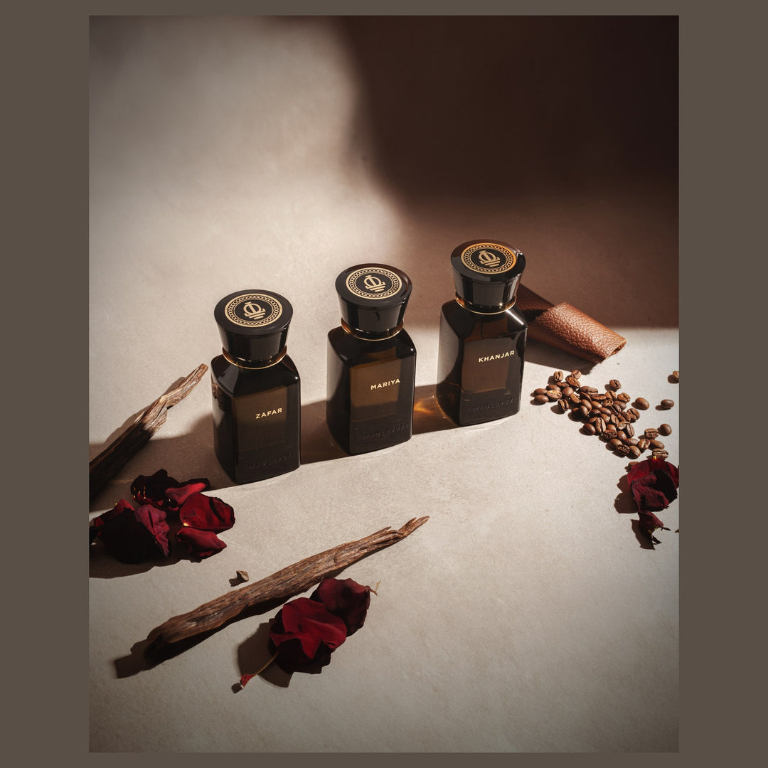 Oman Luxury Khanjar Eau de Parfum bottle with dried roses and agarwood chips