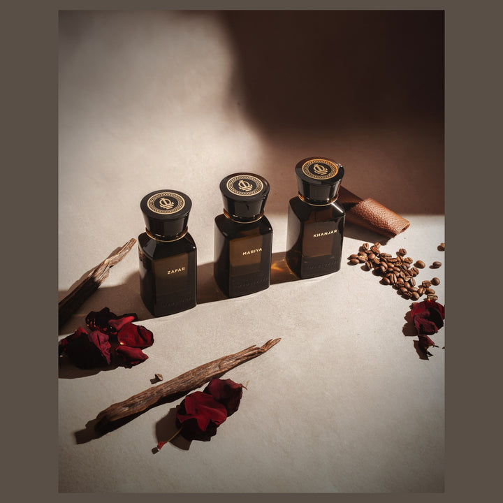 Oman Luxury Khanjar Eau de Parfum bottle with dried roses and agarwood chips