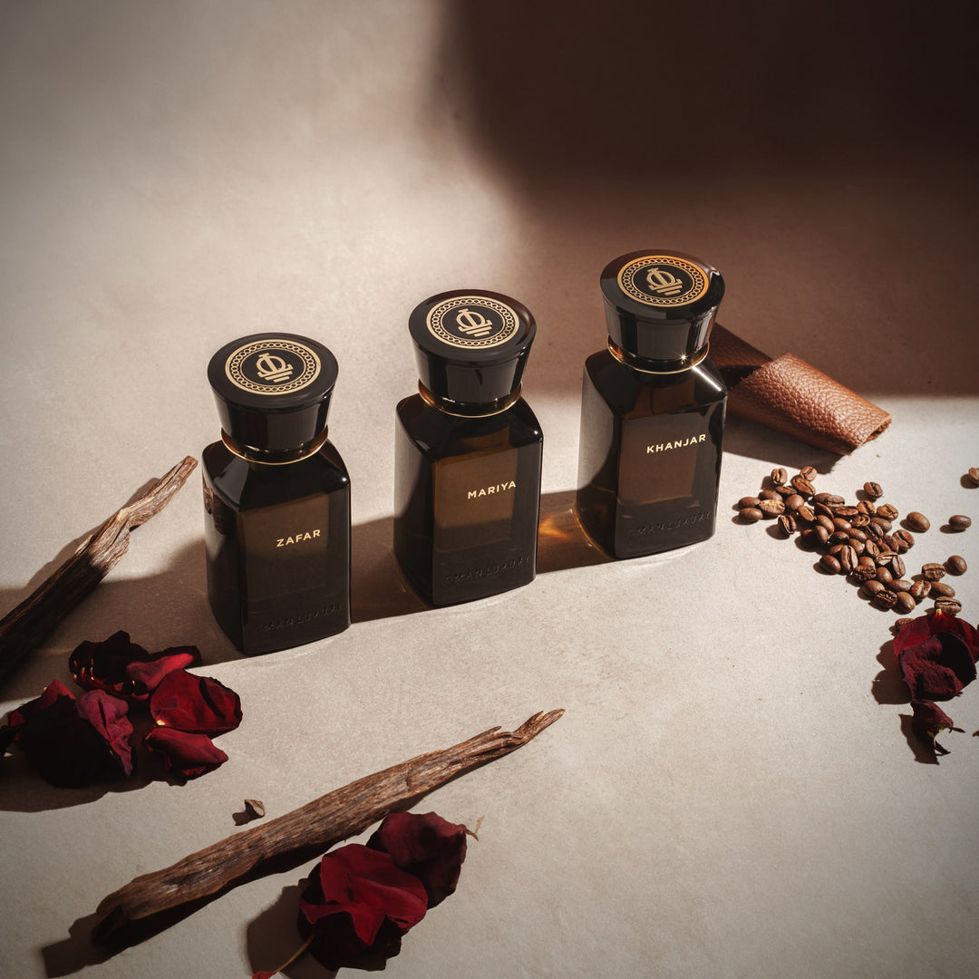 Oman Luxury Khanjar Eau de Parfum bottle with dried roses and agarwood chips