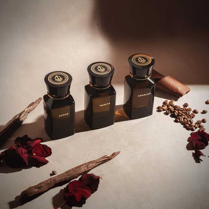 Oman Luxury Khanjar Eau de Parfum bottle with dried roses and agarwood chips