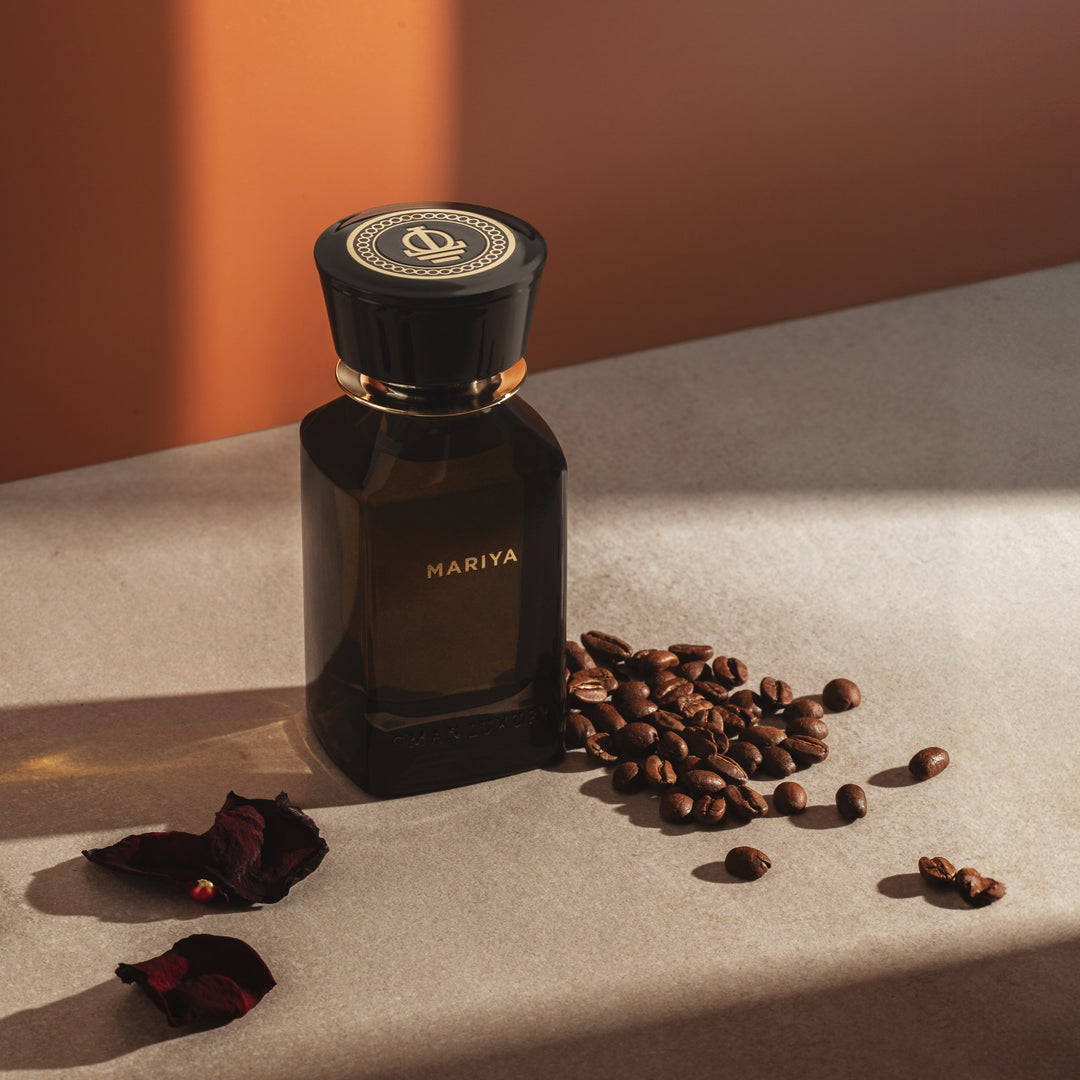 Oman Luxury Mariya Eau de Parfum bottle on a stone ledge with coffee beans