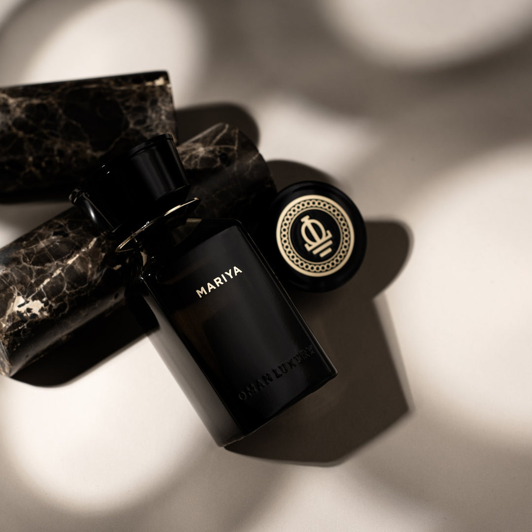 Oman Luxury Mariya Eau de Parfum bottle on black marble with its crested cap