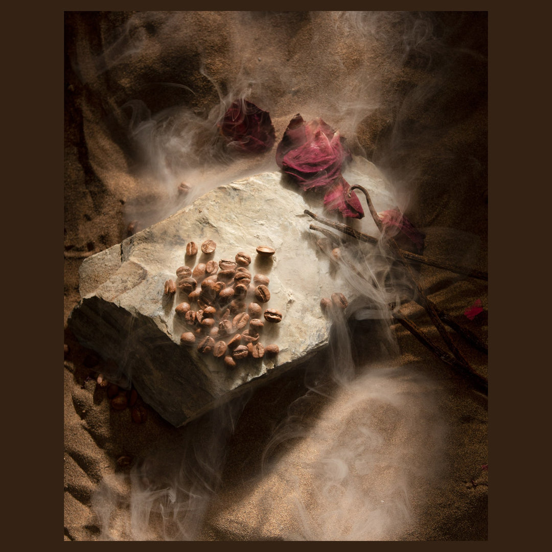 Oman Luxury Mariya Eau de Parfum bottle with rose petals and coffee in soft haze