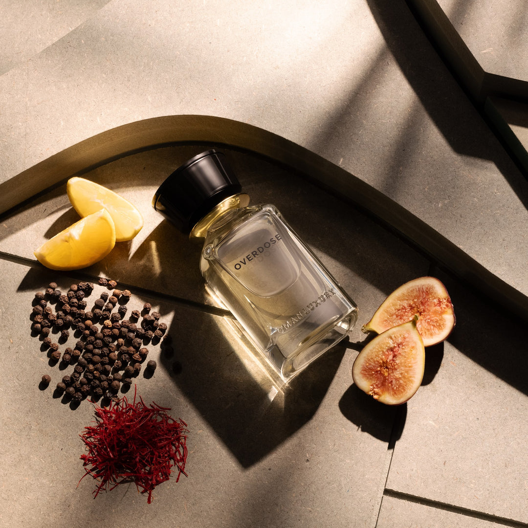Oman Luxury Overdose Eau de Parfum bottle flat lay with fig, saffron and peppercorns