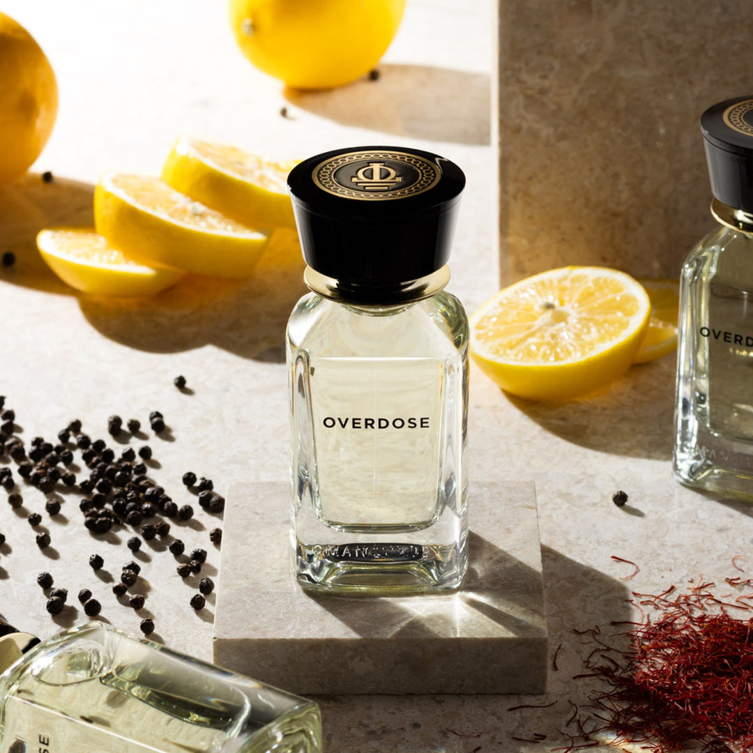 Oman Luxury Overdose Eau de Parfum bottle with cut lemons, saffron and black pepper