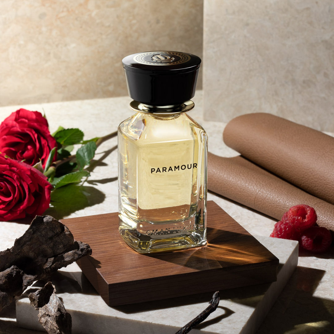 Oman Luxury Paramour Eau de Parfum bottle with red roses and folded leather
