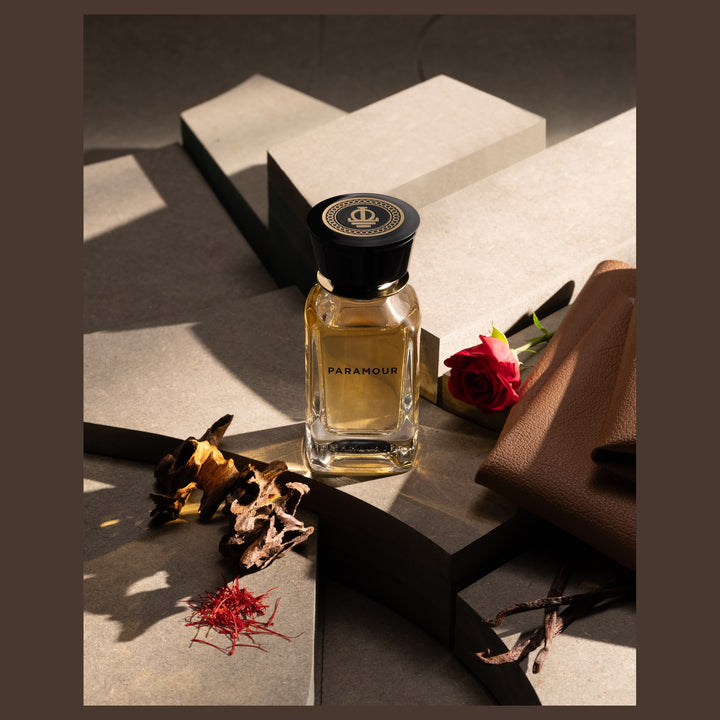 Oman Luxury Paramour Eau de Parfum bottle with saffron threads and leather in low light