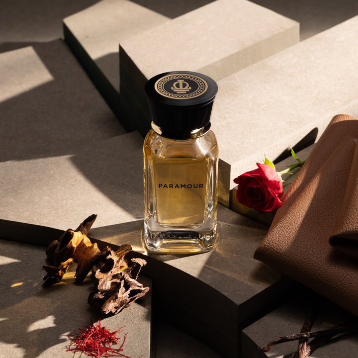 Oman Luxury Paramour Eau de Parfum bottle with saffron threads and leather in low light