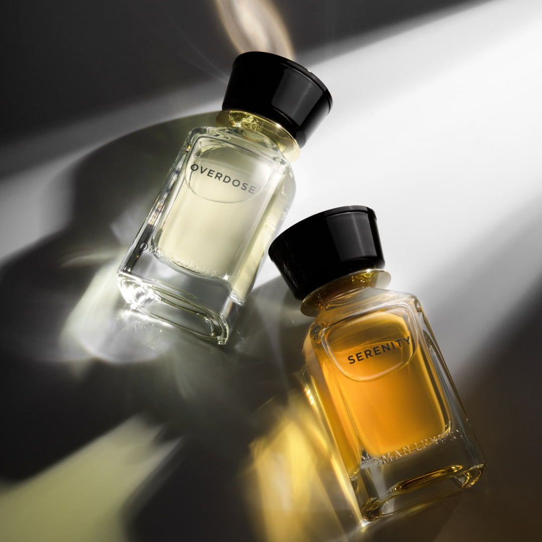 Oman Luxury Serenity Eau de Parfum bottle beside Overdose in a beam of hard light
