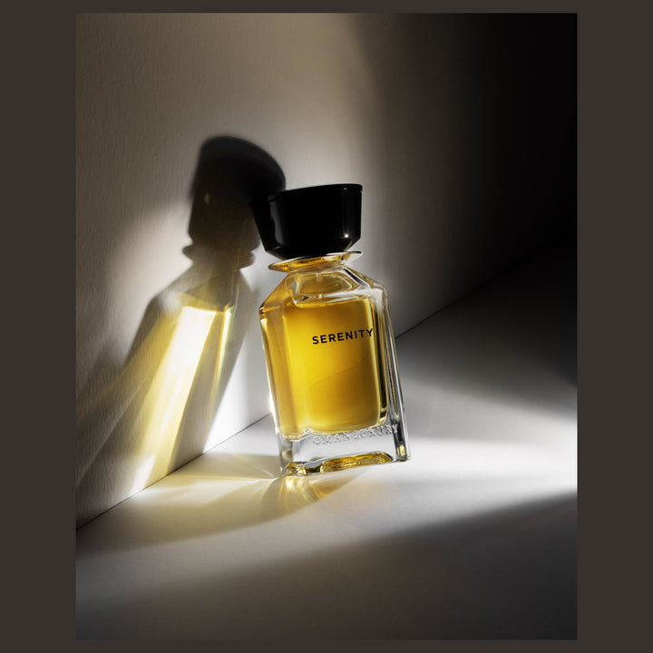Oman Luxury Serenity Eau de Parfum bottle in hard afternoon light and shadow