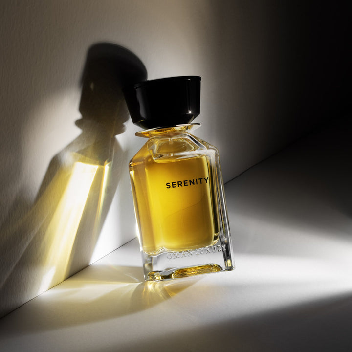 Oman Luxury Serenity Eau de Parfum bottle in hard afternoon light and shadow