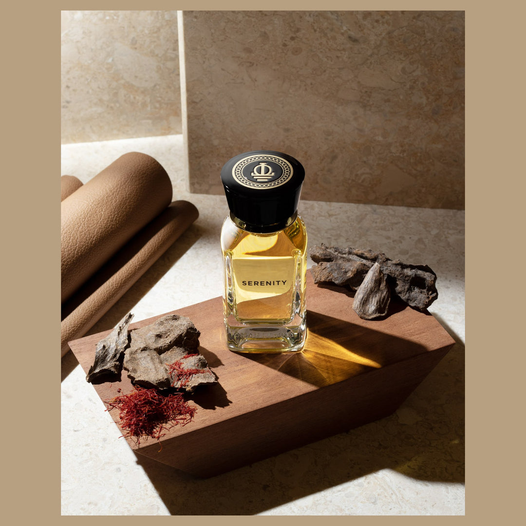 Oman Luxury Serenity Eau de Parfum bottle with agarwood chips and saffron on stone