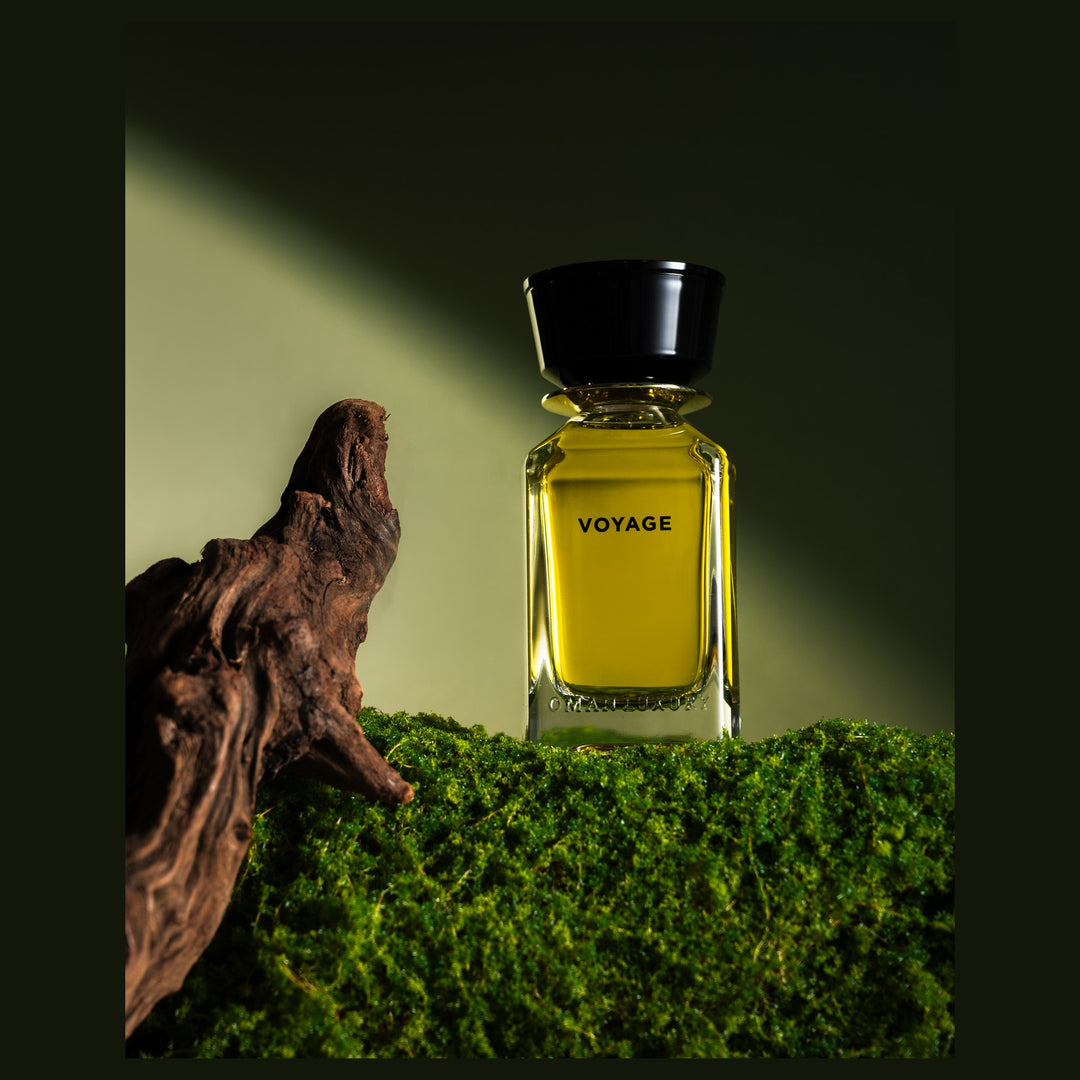 Oman Luxury Voyage Eau de Parfum bottle on moss with driftwood