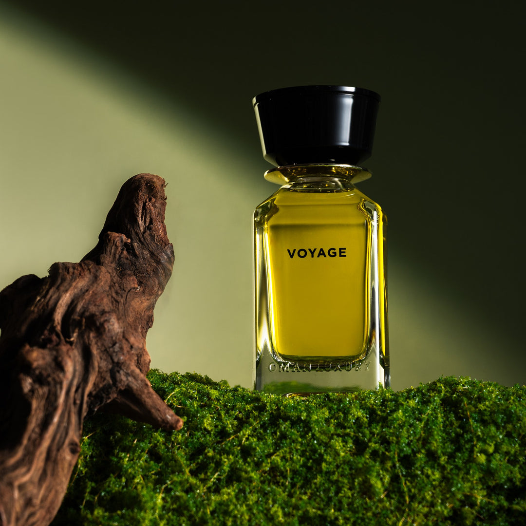 Oman Luxury Voyage Eau de Parfum bottle on moss with driftwood