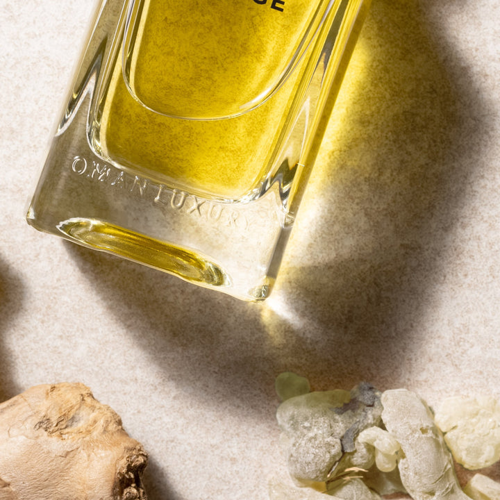 Oman Luxury Voyage Eau de Parfum bottle macro detail beside frankincense tears