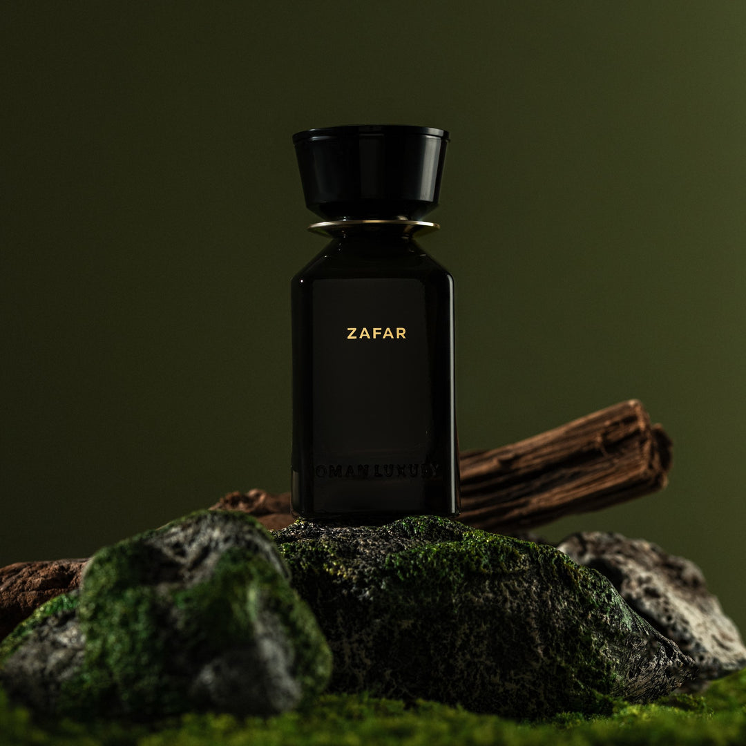 Oman Luxury Zafar Eau de Parfum bottle on moss and rock against green